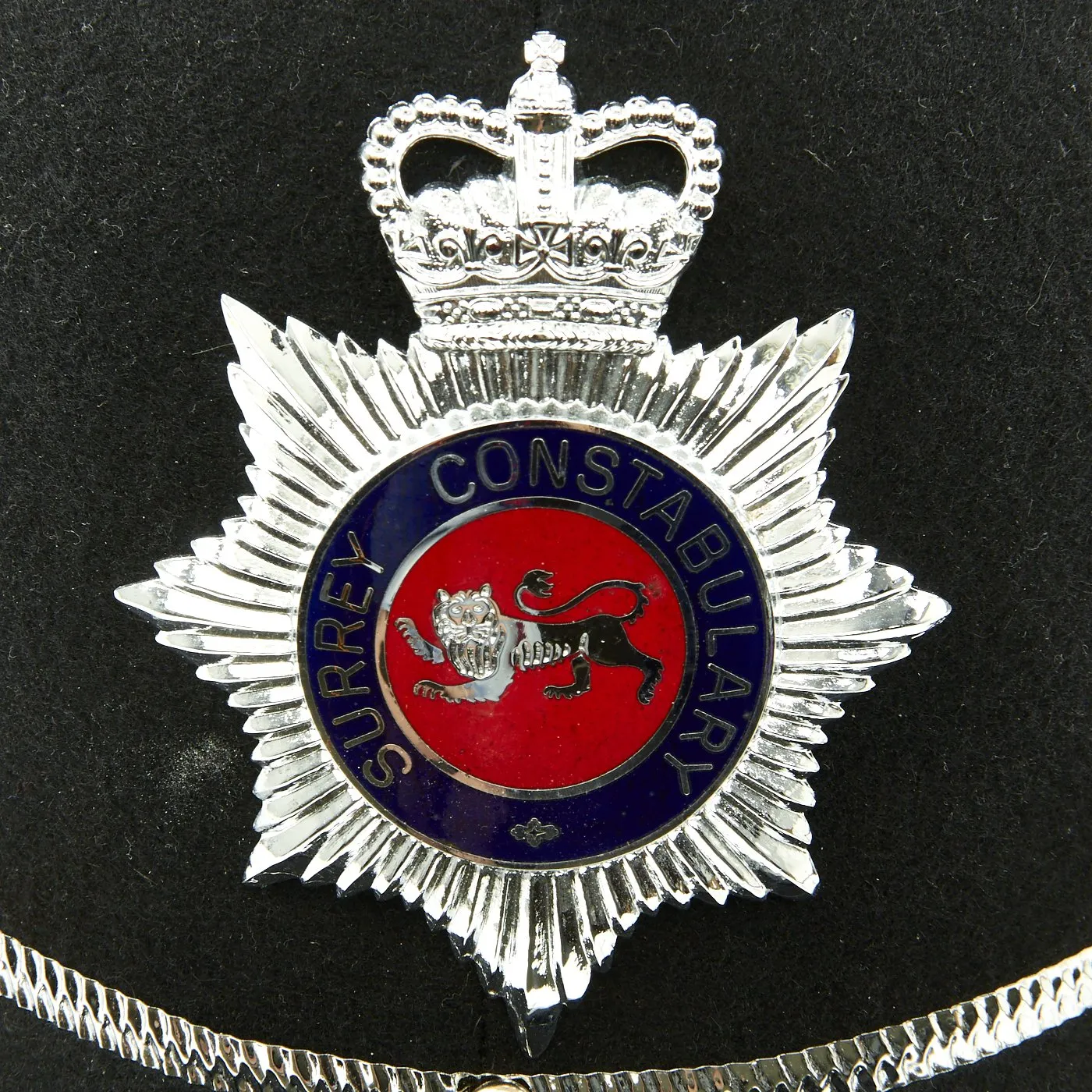 Original British Unissued Rose Top Police Bobby Helmet from the Surrey Constabulary in size 59 - c. 1990